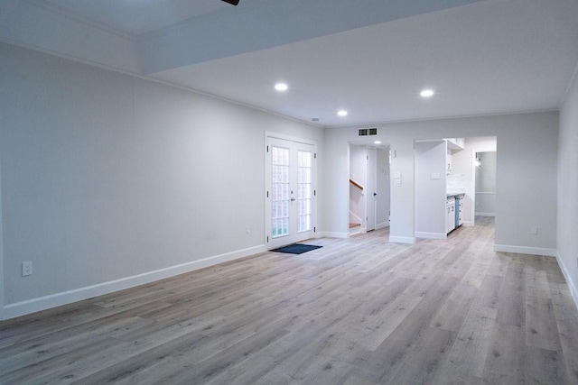 2243 W Alabama St Unit 10, Houston, TX 77098 - unfurnished room featuring baseboards, stairs, light wood-style floors, recessed lighting, and crown molding