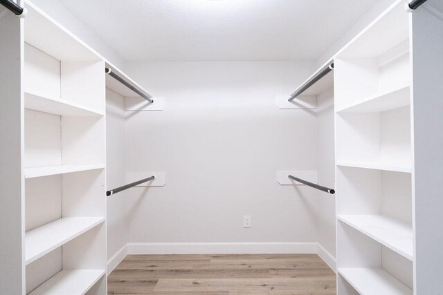 2243 W Alabama St Unit 10, Houston, TX 77098 - spacious closet featuring wood finished floors