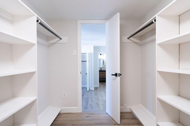 2243 W Alabama St Unit 10, Houston, TX 77098 - spacious closet with light wood finished floors