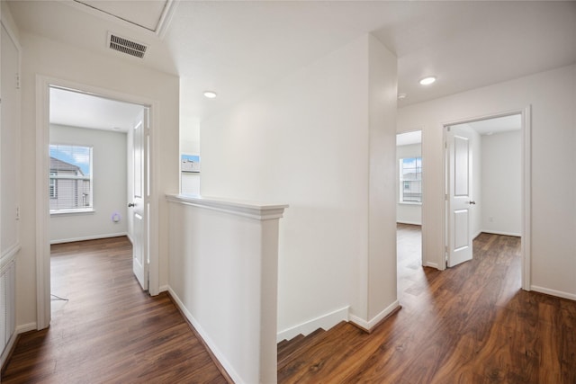 10127 Clearwick St, Houston, TX 77034 - hallway with an upstairs landing, dark wood-style flooring, baseboards, and recessed lighting