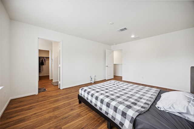 10127 Clearwick St, Houston, TX 77034 - bedroom featuring wood finished floors, baseboards, a spacious closet, a closet, and recessed lighting