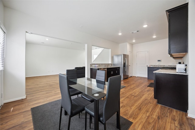 10127 Clearwick St, Houston, TX 77034 - dining space with wood finished floors, recessed lighting, and baseboards
