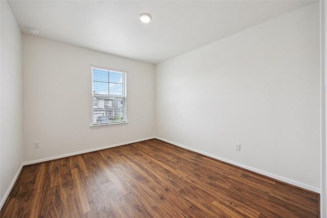 10127 Clearwick St, Houston, TX 77034 - unfurnished room featuring dark wood-style floors and baseboards