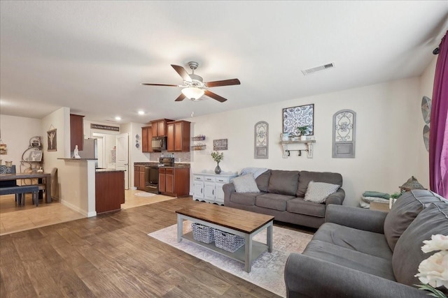 6011 Treasure Cove Rd, Cove, TX 77523 - living room featuring ceiling fan, light wood finished floors, and recessed lighting