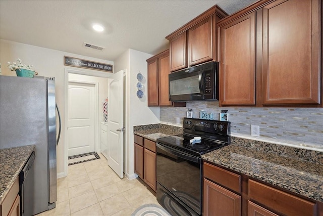 6011 Treasure Cove Rd, Cove, TX 77523 - kitchen featuring black appliances, light tile patterned floors, tasteful backsplash, and dark stone countertops