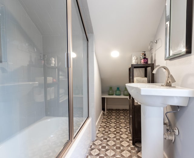 1827 Port O Call St, Tiki Island, TX 77554 - full bath with tile patterned floors, combined bath / shower with glass door, and vaulted ceiling