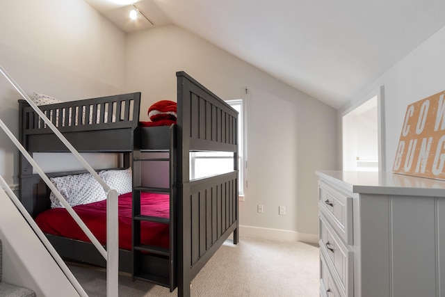 1827 Port O Call St, Tiki Island, TX 77554 - bedroom with vaulted ceiling, baseboards, and light carpet
