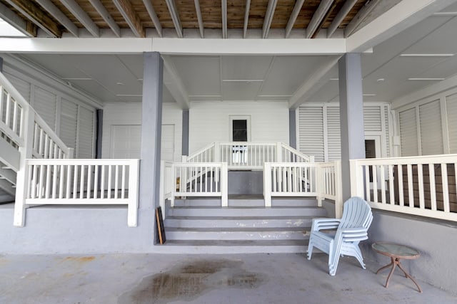1827 Port O Call St, Tiki Island, TX 77554 - doorway to property featuring a porch