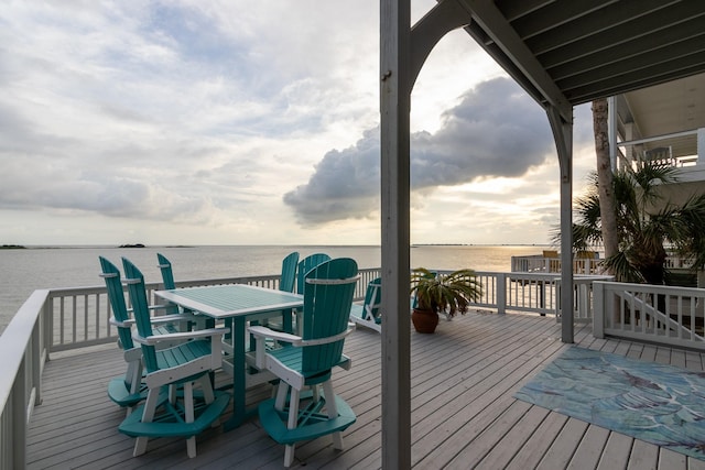 1827 Port O Call St, Tiki Island, TX 77554 - wooden deck featuring a water view and outdoor dining space