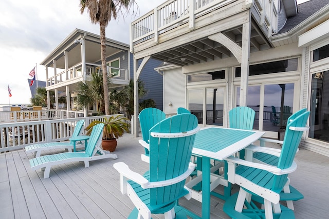 1827 Port O Call St, Tiki Island, TX 77554 - wooden deck with outdoor dining area