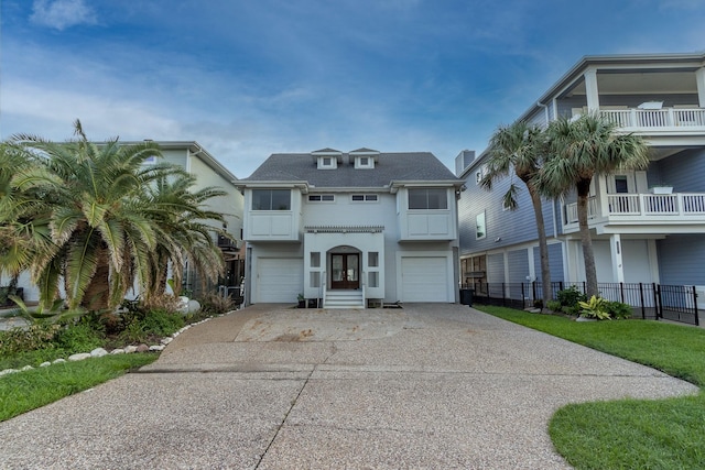 1827 Port O Call St, Tiki Island, TX 77554 - coastal home with driveway, an attached garage, and french doors