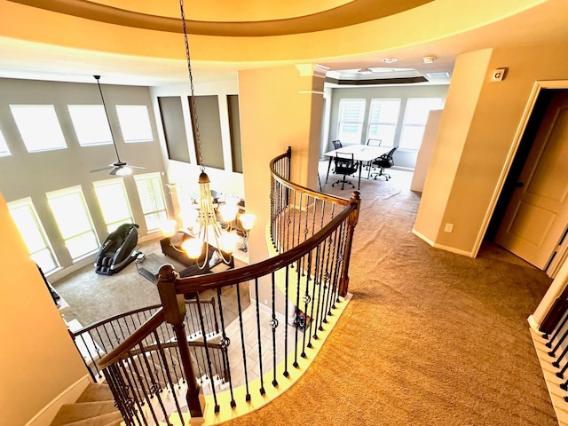7739 Augusta Creek Ct, Spring, TX 77389 - hall with carpet floors, an upstairs landing, baseboards, and a chandelier