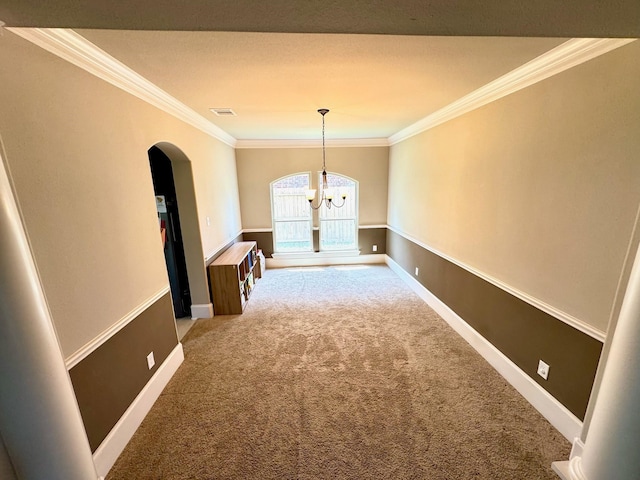 7739 Augusta Creek Ct, Spring, TX 77389 - spare room featuring arched walkways, a chandelier, light colored carpet, crown molding, and baseboards