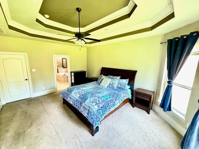 7739 Augusta Creek Ct, Spring, TX 77389 - bedroom with a raised ceiling, ornamental molding, carpet floors, baseboards, and ensuite bathroom