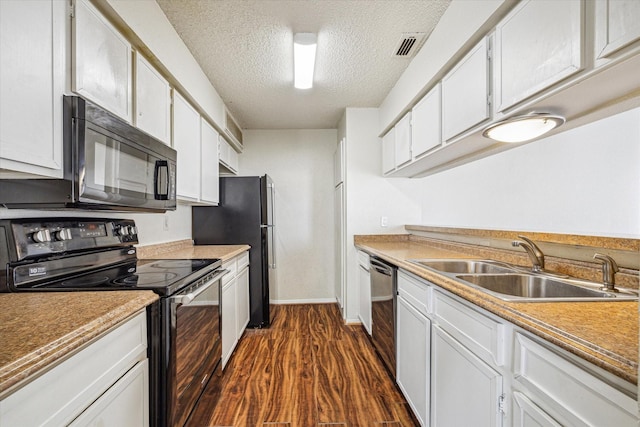 6701 Sands Point Dr Unit 129, Houston, TX 77074 - kitchen featuring black appliances, a sink, a textured ceiling, dark wood finished floors, and white cabinets