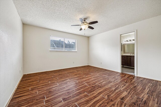 6701 Sands Point Dr Unit 129, Houston, TX 77074 - spare room with ceiling fan, wood finished floors, a textured ceiling, and baseboards
