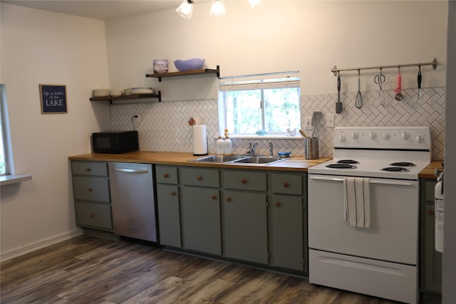 465 Creek Dr, Onalaska, TX 77360 - kitchen with white range with electric stovetop, dishwasher, black microwave, a sink, and decorative backsplash