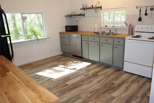 465 Creek Dr, Onalaska, TX 77360 - kitchen featuring black appliances, butcher block countertops, a sink, decorative backsplash, and open shelves
