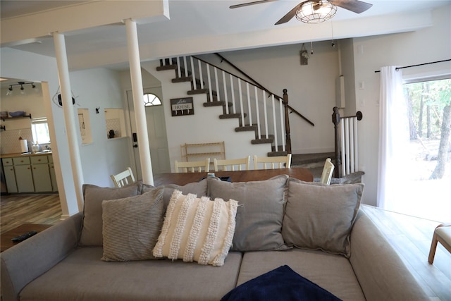 465 Creek Dr, Onalaska, TX 77360 - living room featuring ceiling fan, stairs, and wood finished floors