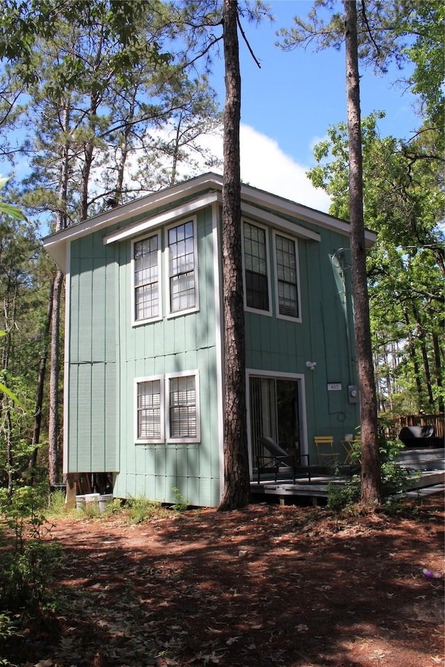 465 Creek Dr, Onalaska, TX 77360 - view of side of property featuring board and batten siding