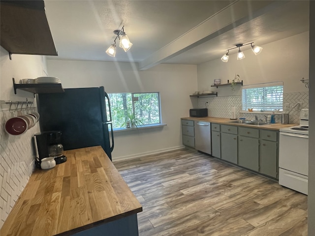 465 Creek Dr, Onalaska, TX 77360 - kitchen featuring wooden counters, white electric stove, freestanding refrigerator, stainless steel dishwasher, and open shelves
