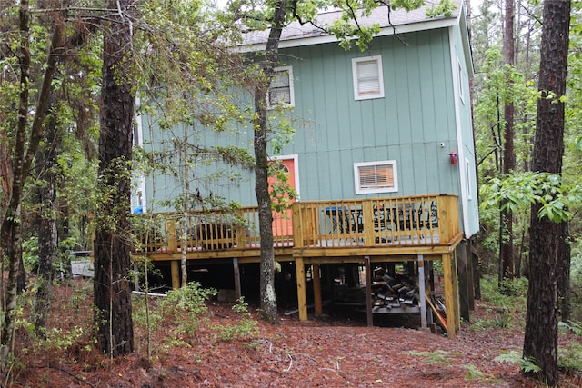 465 Creek Dr, Onalaska, TX 77360 - rear view of house with a wooden deck and a shingled roof