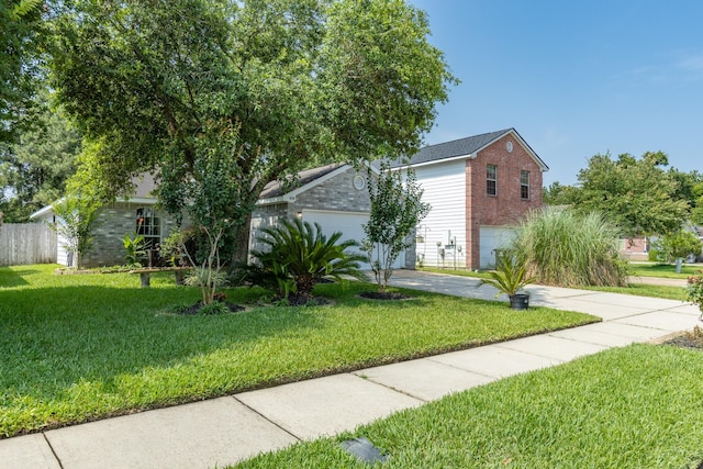 414 Laurel Sage Dr, Houston, TX 77339 - view of front of property featuring brick siding, concrete driveway, and an attached garage