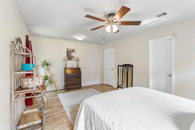 414 Laurel Sage Dr, Houston, TX 77339 - bedroom featuring wood finished floors, ceiling fan, and baseboards
