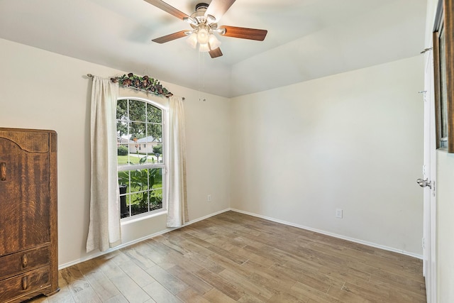 414 Laurel Sage Dr, Houston, TX 77339 - unfurnished room featuring a ceiling fan, light wood finished floors, baseboards, and vaulted ceiling