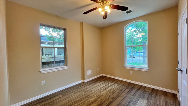 712 Lettie St, Richmond, TX 77469 - unfurnished room with healthy amount of natural light, dark wood-style floors, baseboards, and ceiling fan