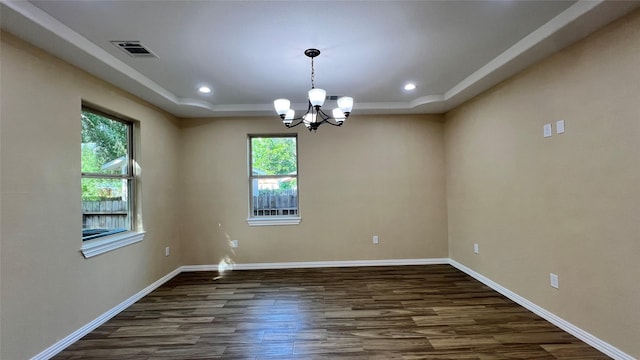 712 Lettie St, Richmond, TX 77469 - empty room featuring a raised ceiling, dark wood finished floors, a chandelier, baseboards, and recessed lighting