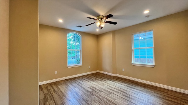 712 Lettie St, Richmond, TX 77469 - empty room featuring wood finished floors, baseboards, ceiling fan, recessed lighting, and a smoke detector