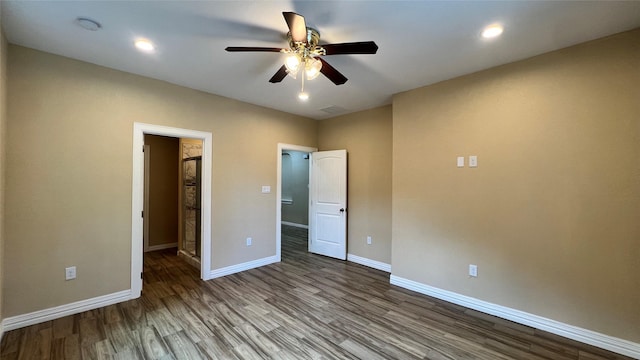 712 Lettie St, Richmond, TX 77469 - unfurnished bedroom with wood finished floors, baseboards, a ceiling fan, and recessed lighting