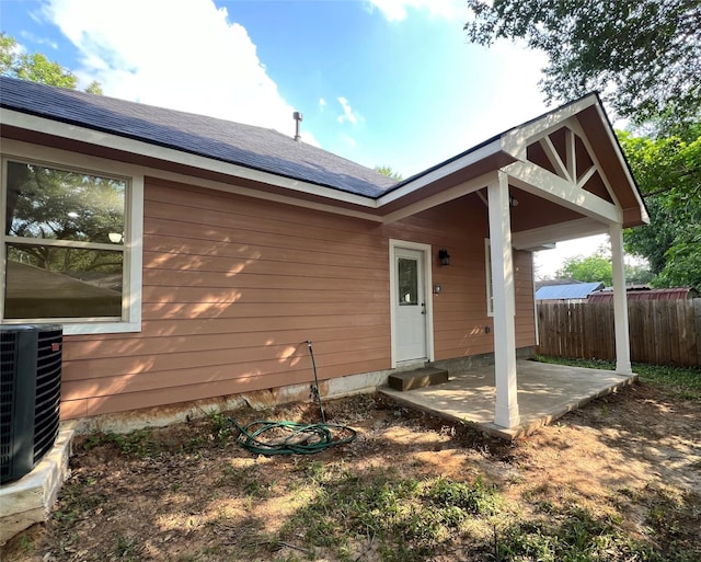 712 Lettie St, Richmond, TX 77469 - back of house featuring a patio and central AC unit