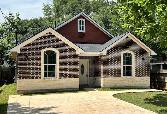 712 Lettie St, Richmond, TX 77469 - view of front of property with brick siding and roof with shingles