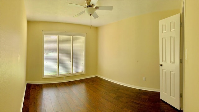 915 Marys Ct, Friendswood, TX 77546 - spare room with dark wood-style floors, ceiling fan, and baseboards