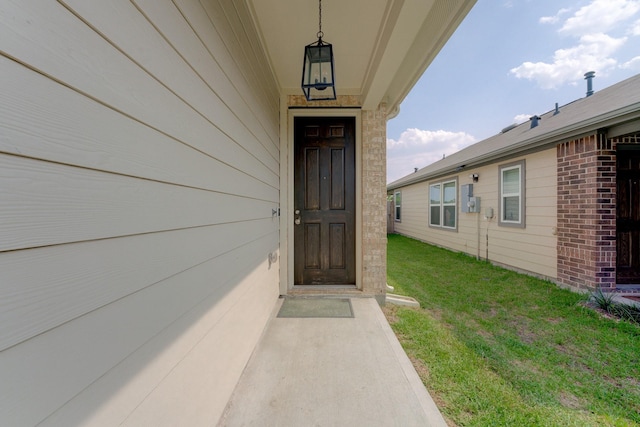 5022 Jonina Ln, Houston, TX 77048 - view of exterior entry featuring a yard and brick siding