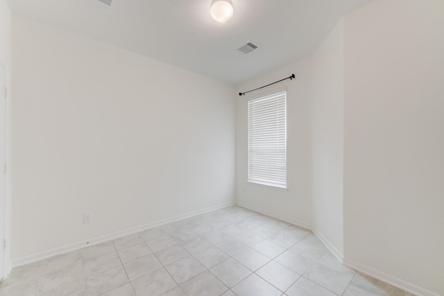 5022 Jonina Ln, Houston, TX 77048 - empty room with light tile patterned flooring and baseboards