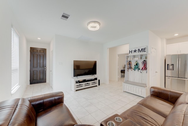 5022 Jonina Ln, Houston, TX 77048 - living room featuring light tile patterned floors and recessed lighting
