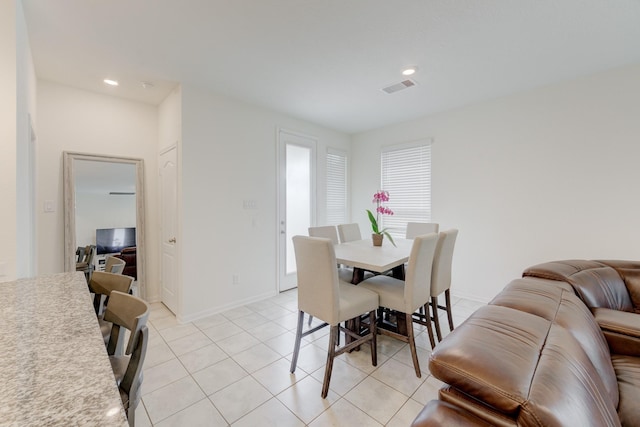 5022 Jonina Ln, Houston, TX 77048 - dining room with light tile patterned floors, recessed lighting, and baseboards