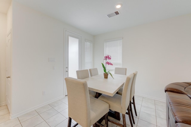 5022 Jonina Ln, Houston, TX 77048 - dining room featuring light tile patterned floors, baseboards, and recessed lighting