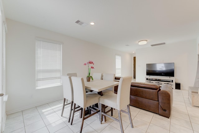 5022 Jonina Ln, Houston, TX 77048 - dining space with light tile patterned floors and recessed lighting