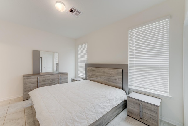 5022 Jonina Ln, Houston, TX 77048 - bedroom featuring baseboards and tile patterned flooring