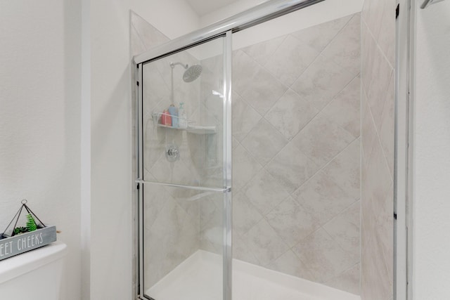 5022 Jonina Ln, Houston, TX 77048 - bathroom featuring toilet and a stall shower