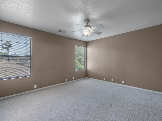 2031 Upland Hill St, Spring, TX 77373 - carpeted empty room featuring a textured ceiling, a ceiling fan, and baseboards