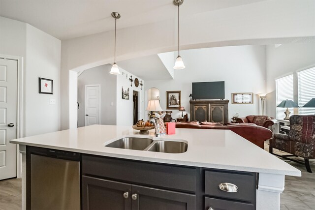 356 Selah Ct, Alvin, TX 77511 - kitchen with a sink, open floor plan, arched walkways, light countertops, and a kitchen island with sink