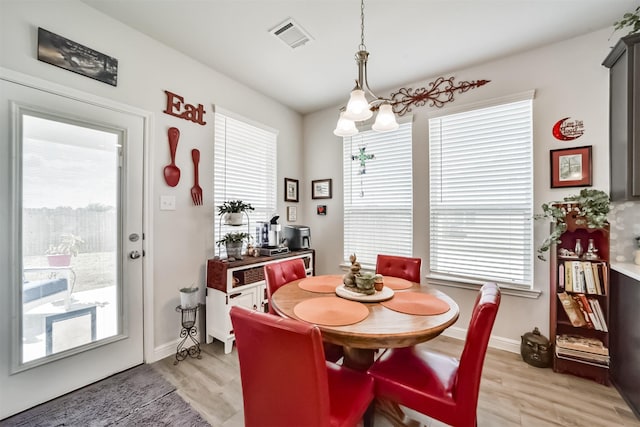 356 Selah Ct, Alvin, TX 77511 - dining room with plenty of natural light, light wood finished floors, and baseboards