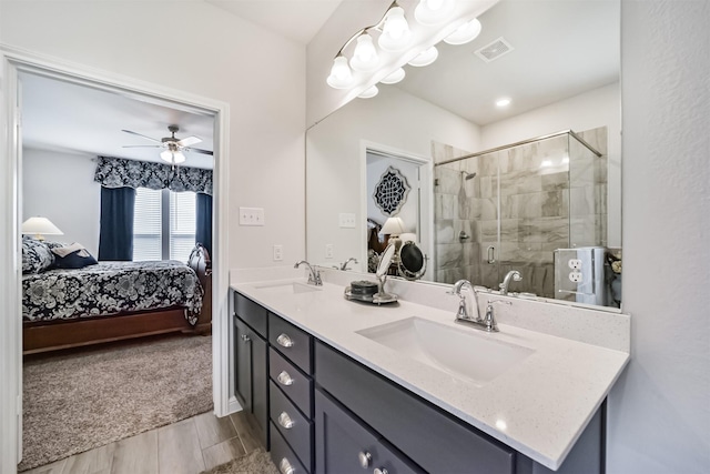 356 Selah Ct, Alvin, TX 77511 - bathroom featuring ensuite bathroom, double vanity, a shower stall, and ceiling fan