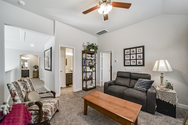 356 Selah Ct, Alvin, TX 77511 - living room featuring attic access, carpet flooring, ceiling fan, baseboards, and vaulted ceiling