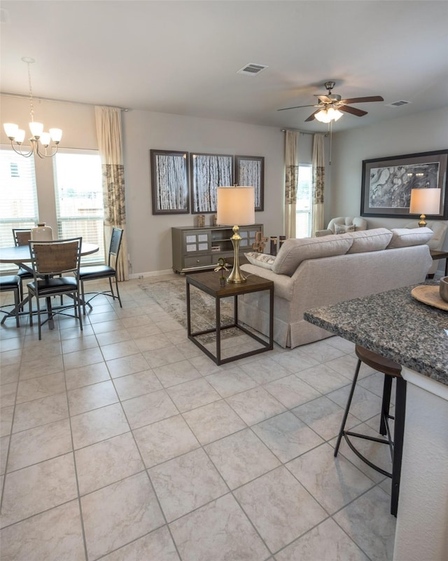 214 Emerald Thicket Ln, Humble, TX 77336 - living area featuring plenty of natural light, a chandelier, ceiling fan, and light tile patterned floors